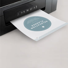 Load image into Gallery viewer, A black printer printing the "Relocation Planner" Title page that is teal and white.